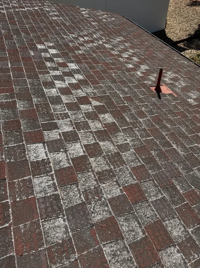 Old worn shingle roof with weathered surfaces
