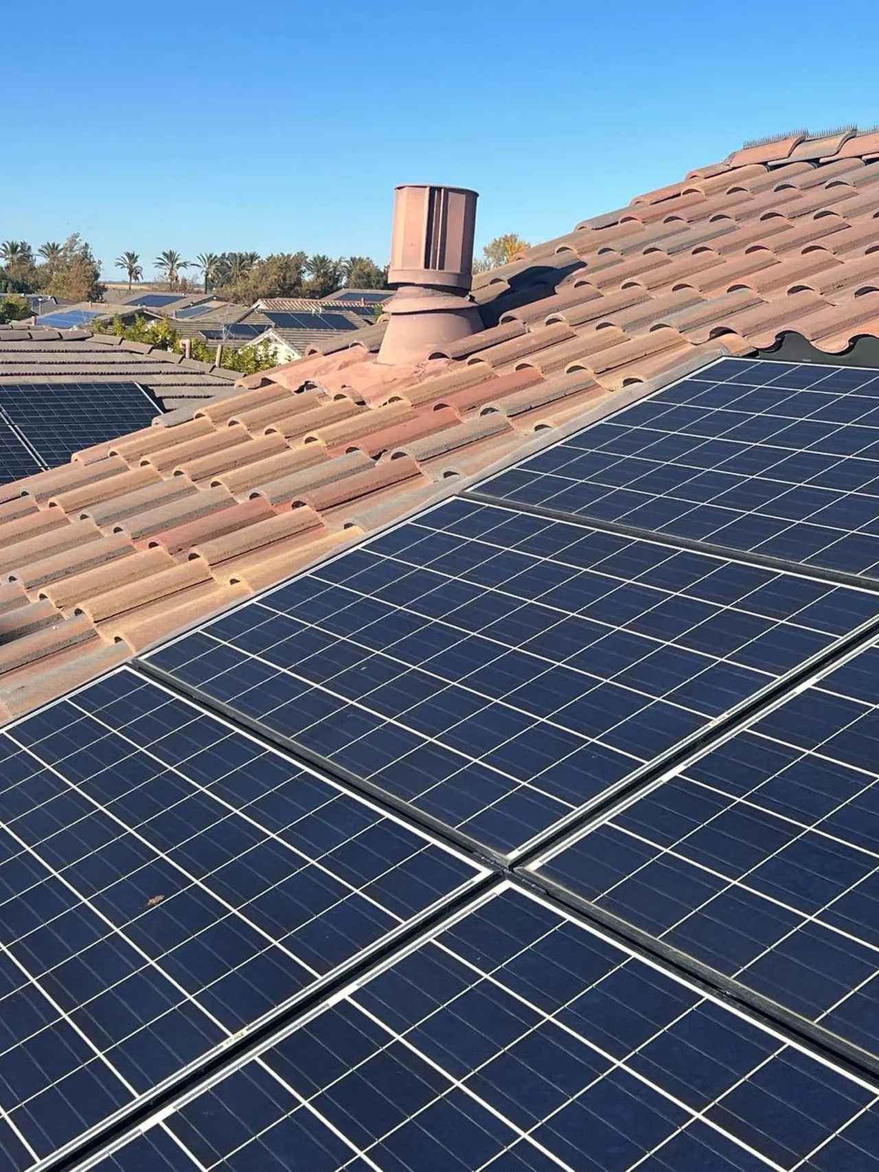 Finished concrete tile roof with solar panels