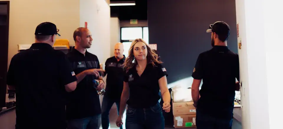 Spartan team members working together in the office