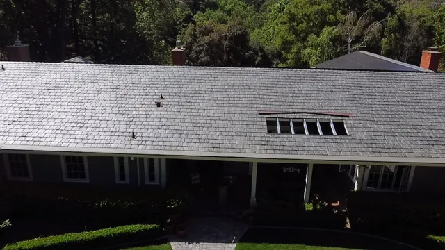 Synthetic slate roof with a skylight above the front porch