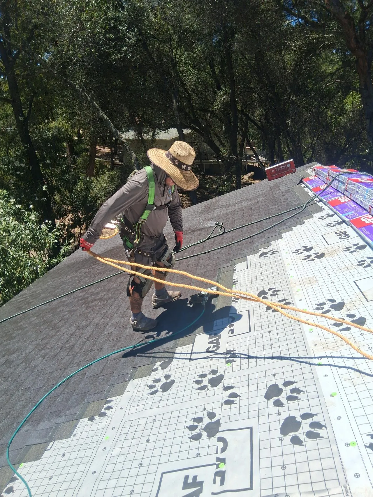 Spartan roofer installing GAF shingles
