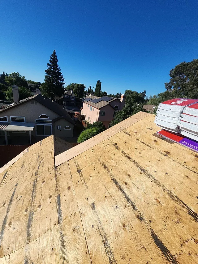 Repaired roof woodwork and exposed decking before shingle installation