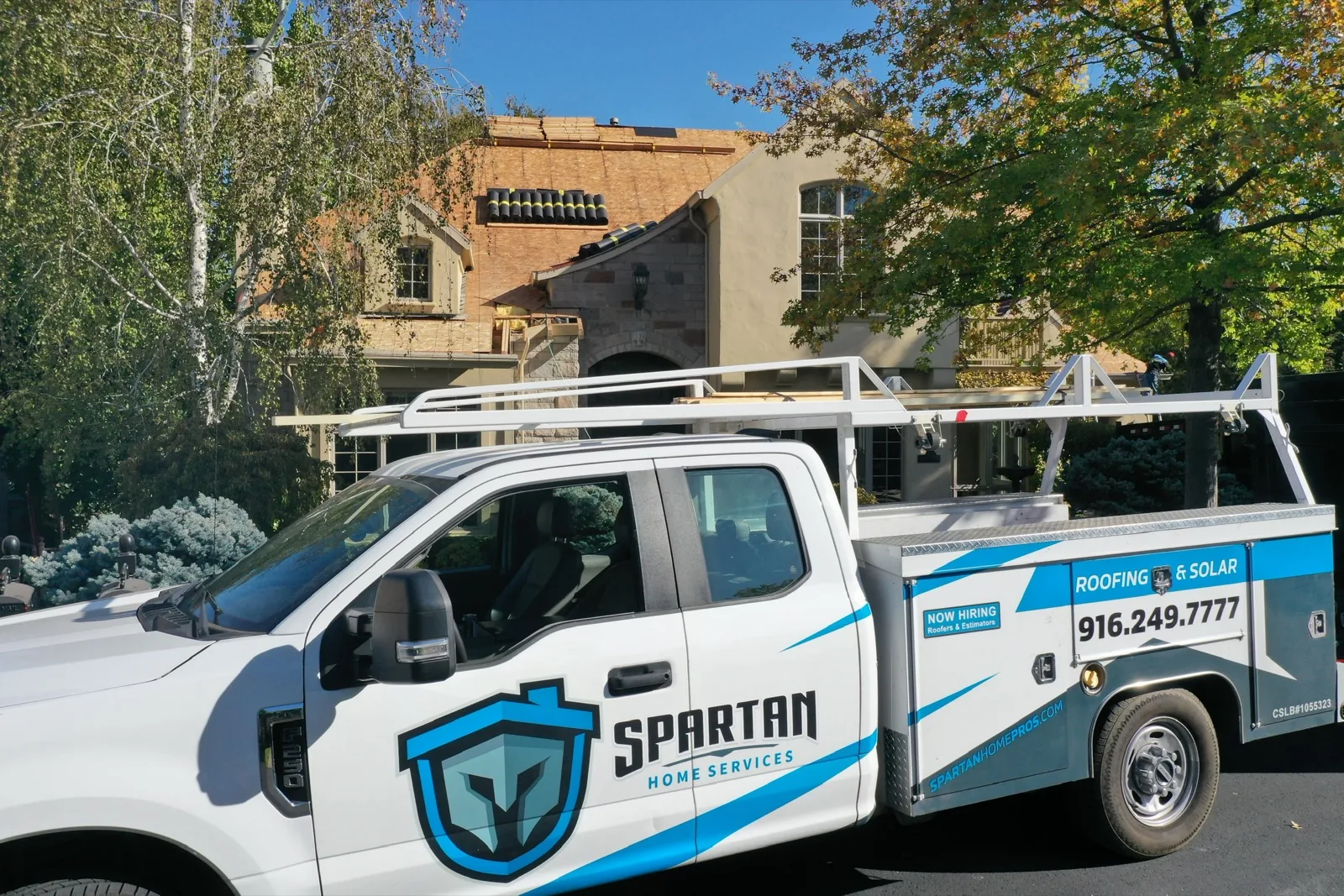 Spartan truck at a tile roof replacement
