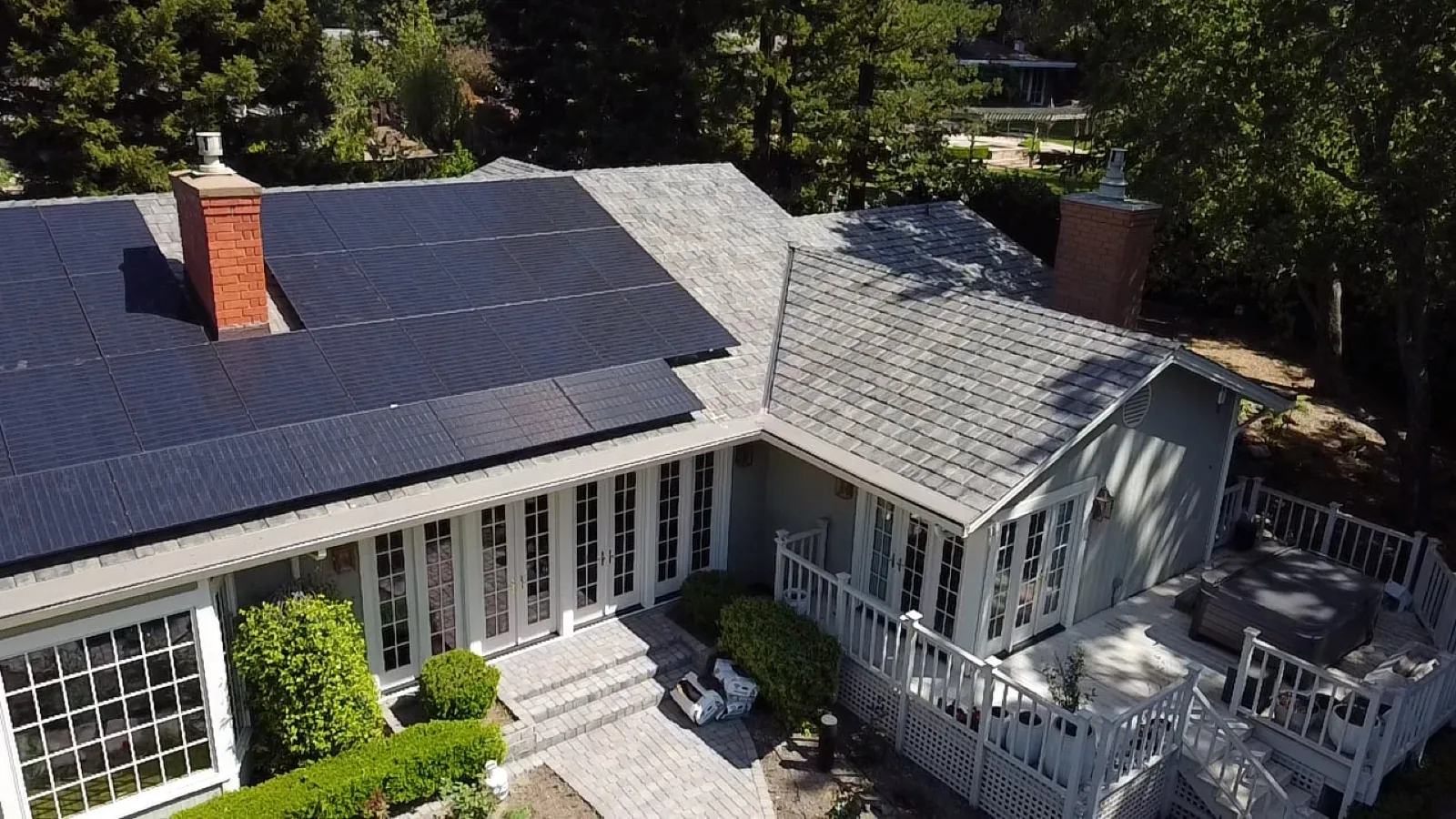 Synthetic slate roof with reinstalled solar panels by Spartan